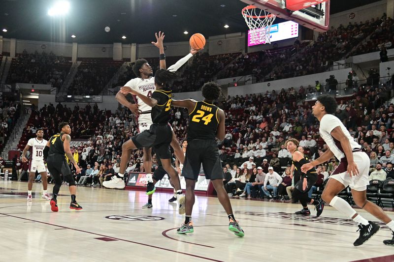 Feb 4, 2023; Starkville, Mississippi, USA; Mississippi State Bulldogs guard Cameron Matthews (4) goes up for a shot while defended by Missouri Tigers guard Sean East II (55)  at Humphrey Coliseum. Mandatory Credit: Matt Bush-USA TODAY Sports