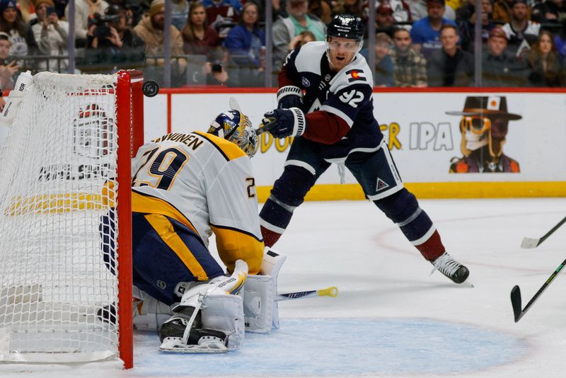 Dec 13, 2025; Denver, Colorado, USA; Colorado Avalanche left wing Gabriel Landeskog (92) hits the post on a shot against Nashville Predators goaltender Justus Annunen (29) in the second period at Ball Arena. Mandatory Credit: Isaiah J. Downing-Imagn Images