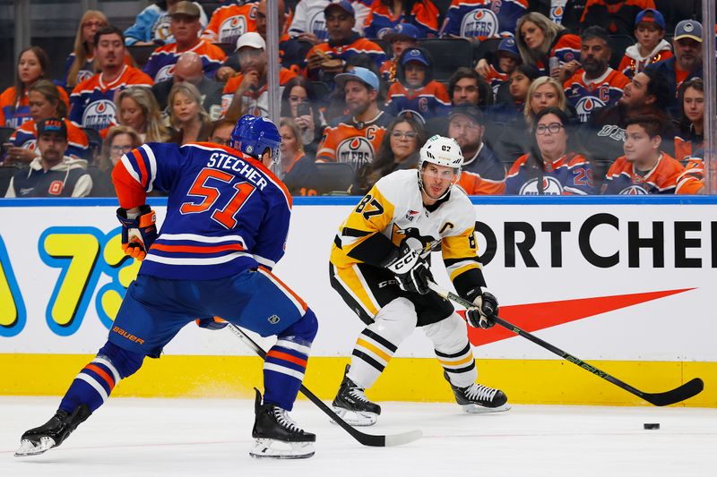 Oct 25, 2024; Edmonton, Alberta, CAN; Pittsburgh Penguins forward Sidney Crosby (87) looks to make a pass in front of Edmonton Oilers defensemen Troy Stecher (51) during the second period at Rogers Place. Mandatory Credit: Perry Nelson-Imagn Images