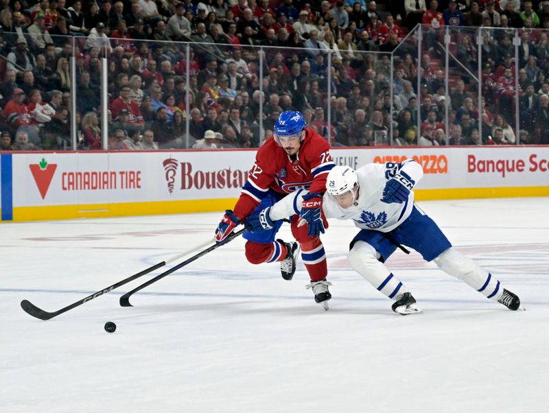 Oct 9, 2024; Montreal, Quebec, CAN; Montreal Canadiens defenseman Arber Xhekaj (72) and Toronto Maple Leafs forward Pontus Holmberg (29) battle for the puck during the first period at the Bell Centre. Mandatory Credit: Eric Bolte-Imagn Images