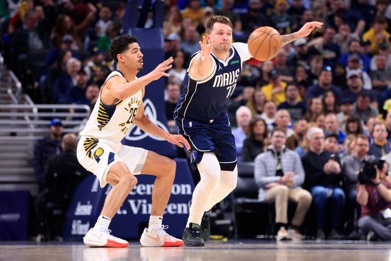 INDIANAPOLIS, INDIANA - FEBRUARY 25: Luka Doncic #77 of the Dallas Mavericks steals the ball from Ben Sheppard #26 of the Indiana Pacers during the first half at Gainbridge Fieldhouse on February 25, 2024 in Indianapolis, Indiana. NOTE TO USER: User expressly acknowledges and agrees that, by downloading and or using this photograph, User is consenting to the terms and conditions of the Getty Images License Agreement. (Photo by Justin Casterline/Getty Images)