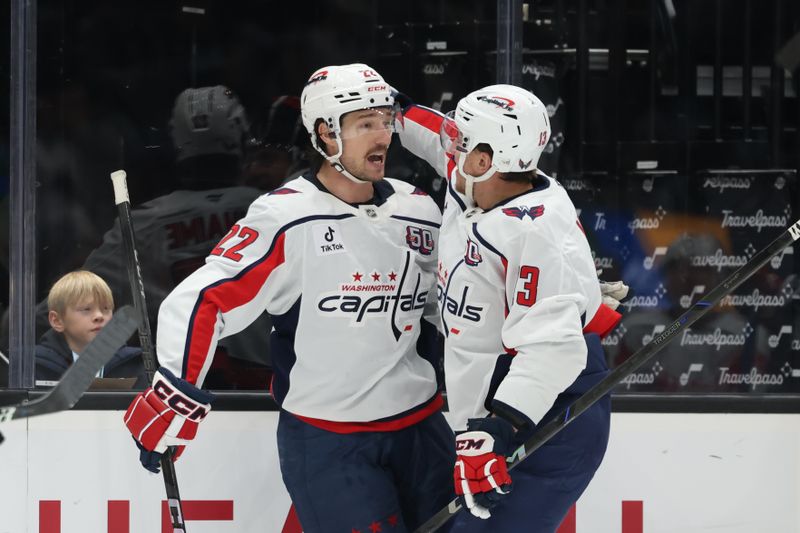 Nov 18, 2024; Salt Lake City, Utah, USA; Washington Capitals right wing Brandon Duhaime (22) celebrates scoring a goal against the Utah Hockey Club with defenseman Matt Roy (3  during the third period at Delta Center. Mandatory Credit: Rob Gray-Imagn Images