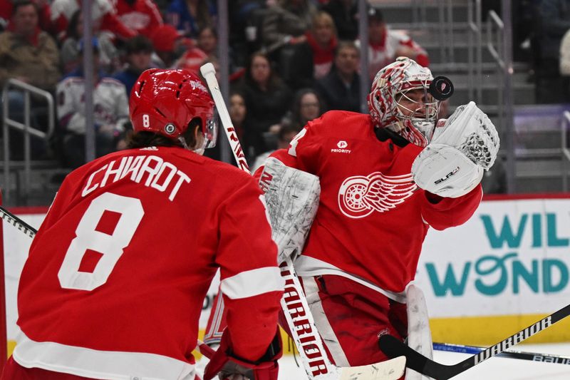 Apr 5, 2024; Detroit, Michigan, USA; Detroit Red Wings goaltender Alex Lyon (34) makes a save during the third period against the New York Rangers at Little Caesars Arena. Mandatory Credit: Tim Fuller-USA TODAY Sports