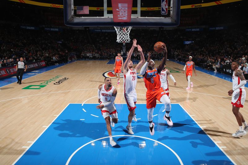 OKLAHOMA CITY, OK - FEBRUARY 27: Luguentz Dort #5 of the Oklahoma City Thunder drives to the basket during the game against the Houston Rockets on February, 2024 at Paycom Arena in Oklahoma City, Oklahoma. NOTE TO USER: User expressly acknowledges and agrees that, by downloading and or using this photograph, User is consenting to the terms and conditions of the Getty Images License Agreement. Mandatory Copyright Notice: Copyright 2024 NBAE (Photo by Zach Beeker/NBAE via Getty Images)