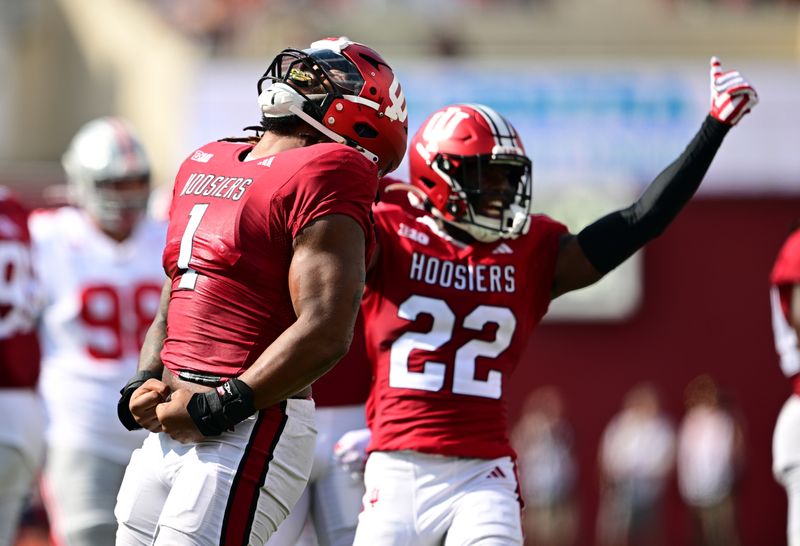 Sep 2, 2023; Bloomington, Indiana, USA; Indiana Hoosiers defensive lineman Andre Carter (1) and Indiana Hoosiers defensive back Jamari Sharpe (22) celebrate a sack during the second quarter against the Ohio State Buckeyes at Memorial Stadium. Mandatory Credit: Marc Lebryk-USA TODAY Sports