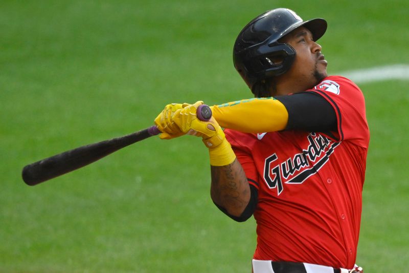 May 21, 2024; Cleveland, Ohio, USA; Cleveland Guardians third baseman Jose Ramirez (11) hits a two-run home run in the fifth inning against the New York Mets at Progressive Field. Mandatory Credit: David Richard-USA TODAY Sports