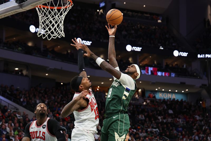 MILWAUKEE, WISCONSIN - DECEMBER 11: Bobby Portis #9 of the Milwaukee Bucks shoots over Torrey Craig #13 of the Chicago Bulls during a game at Fiserv Forum on December 11, 2023 in Milwaukee, Wisconsin. NOTE TO USER: User expressly acknowledges and agrees that, by downloading and or using this photograph, User is consenting to the terms and conditions of the Getty Images License Agreement. (Photo by Stacy Revere/Getty Images)