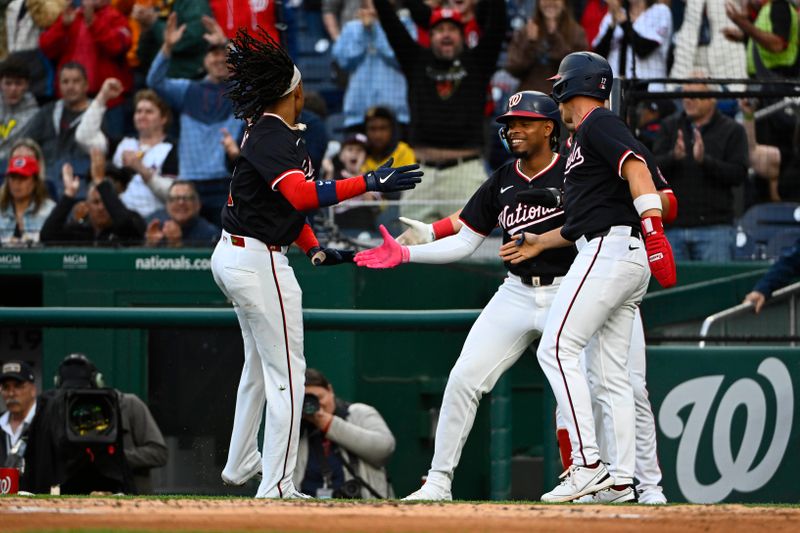 May 22, 2025; Washington, District of Columbia, USA; Washington Nationals shortstop CJ Abrams (5) is congratulated by outfielder Alex Call (17) and third base José Tena (8) after scoring against the Atlanta Braves during the second inning at Nationals Park. Mandatory Credit: Brad Mills-Imagn Images