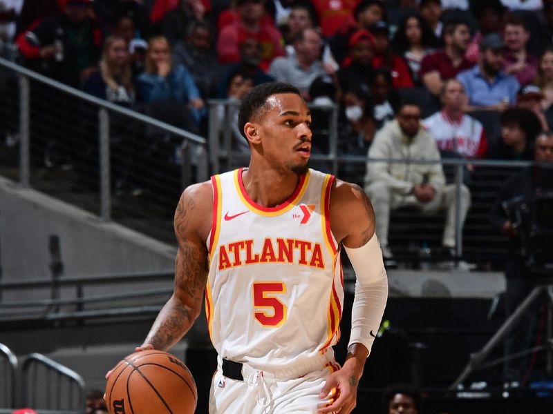 ATLANTA, GA - FEBRUARY 27: Dejounte Murray #5 of the Atlanta Hawks dribbles the ball during the game against the Utah Jazz on February 27, 2024 at State Farm Arena in Atlanta, Georgia.  NOTE TO USER: User expressly acknowledges and agrees that, by downloading and/or using this Photograph, user is consenting to the terms and conditions of the Getty Images License Agreement. Mandatory Copyright Notice: Copyright 2024 NBAE (Photo by Scott Cunningham/NBAE via Getty Images)