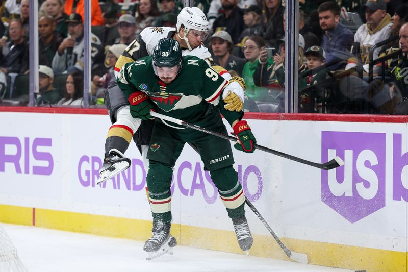 Nov 16, 2025; Saint Paul, Minnesota, USA; Minnesota Wild left wing Marcus Johansson (90) checks Vegas Golden Knights defenseman Ben Hutton (17) during the second period at Grand Casino Arena. Mandatory Credit: Matt Krohn-Imagn Images