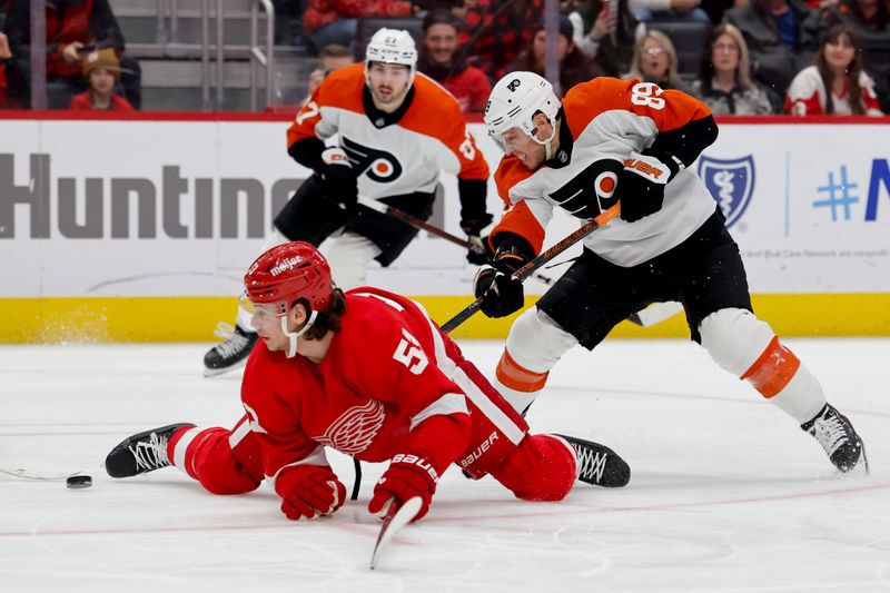 Jan 25, 2024; Detroit, Michigan, USA;  Philadelphia Flyers right wing Cam Atkinson (89) skates with the puck defended by Detroit Red Wings defenseman Moritz Seider (53) in the third period at Little Caesars Arena. Mandatory Credit: Rick Osentoski-USA TODAY Sports