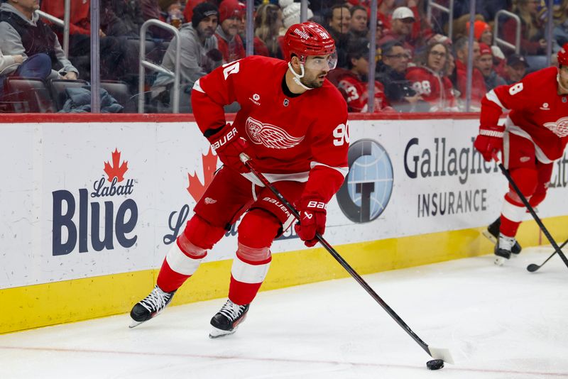 Jan 14, 2025; Detroit, Michigan, USA;  Detroit Red Wings center Joe Veleno (90) skates with the puck in the first period against the San Jose Sharks at Little Caesars Arena. Mandatory Credit: Rick Osentoski-Imagn Images