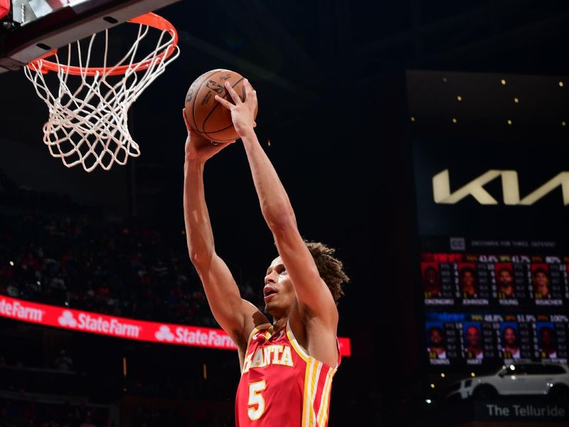 ATLANTA, GA - NOVEMBER 6:  Dyson Daniels #5 of the Atlanta Hawks dunks the ball during the game against the New York Knicks during a regular season game on November 6, 2024 at State Farm Arena in Atlanta, Georgia.  NOTE TO USER: User expressly acknowledges and agrees that, by downloading and/or using this Photograph, user is consenting to the terms and conditions of the Getty Images License Agreement. Mandatory Copyright Notice: Copyright 2024 NBAE (Photo by Scott Cunningham/NBAE via Getty Images)