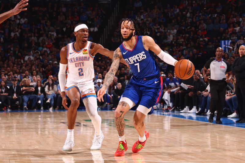 OKLAHOMA CITY, OK - FEBRUARY 22:  Amir Coffey #7 of the LA Clippers handles the ball during the game against the Oklahoma City Thunder on February 22SF, 2024 at Paycom Arena in Oklahoma City, Oklahoma. NOTE TO USER: User expressly acknowledges and agrees that, by downloading and or using this photograph, User is consenting to the terms and conditions of the Getty Images License Agreement. Mandatory Copyright Notice: Copyright 2024 NBAE (Photo by Zach Beeker/NBAE via Getty Images)