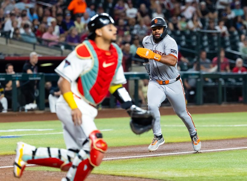 Sep 16, 2025; Phoenix, Arizona, USA; San Francisco Giants outfielder Heliot Ramos runs home to score in the first inning against the Arizona Diamondbacks at Chase Field. Mandatory Credit: Mark J. Rebilas-Imagn Images