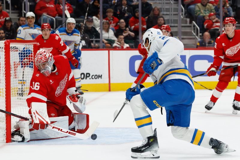 Oct 25, 2025; Detroit, Michigan, USA;  Detroit Red Wings goaltender John Gibson (36) makes the save on St. Louis Blues right wing Jordan Kyrou (25) in the third period at Little Caesars Arena. Mandatory Credit: Rick Osentoski-Imagn Images