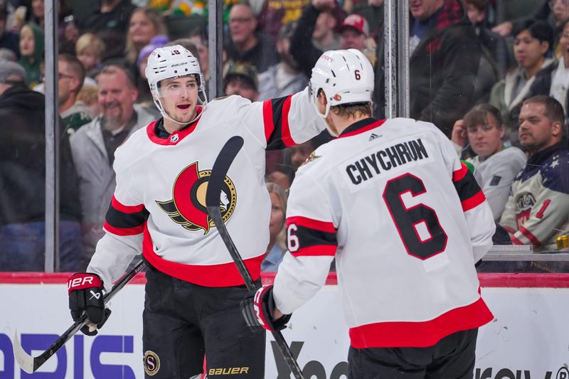 Apr 2, 2024; Saint Paul, Minnesota, USA; Ottawa Senators right wing Drake Batherson (19) celebrates defenseman Jakob Chychrun (6) goal against the Minnesota Wild in the third period at Xcel Energy Center. Mandatory Credit: Brad Rempel-USA TODAY Sports