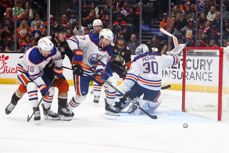 Feb 9, 2024; Anaheim, California, USA; Edmonton Oilers goaltender Calvin Pickard (30) makes a save against Anaheim Ducks center Bo Groulx (24) during the second period of a game at Honda Center. Mandatory Credit: Jessica Alcheh-USA TODAY Sports