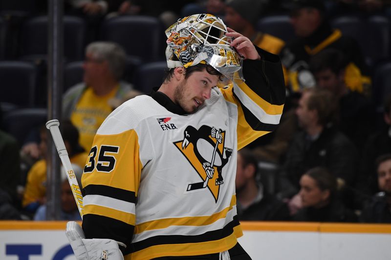 Nov 28, 2023; Nashville, Tennessee, USA; Pittsburgh Penguins goaltender Tristan Jarry (35) skates back to the net after a stoppage in play during the first period against the Nashville Predators at Bridgestone Arena. Mandatory Credit: Christopher Hanewinckel-USA TODAY Sports