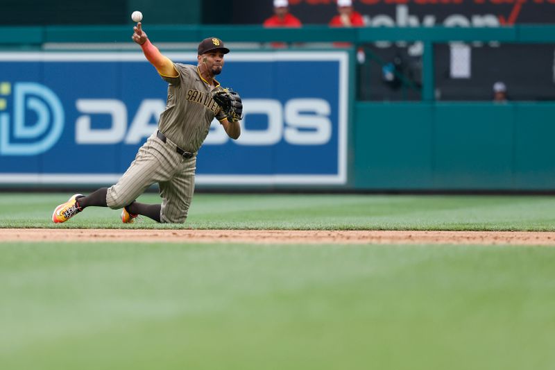 Jul 25, 2024; Washington, District of Columbia, USA; San Diego Padres second baseman Xander Bogaerts (2) bobbles the ball while making a play to first base on a ground ball by Washington Nationals catcher Keibert Ruiz (not pictured) during the eighth inning at Nationals Park. Mandatory Credit: Geoff Burke-USA TODAY Sports