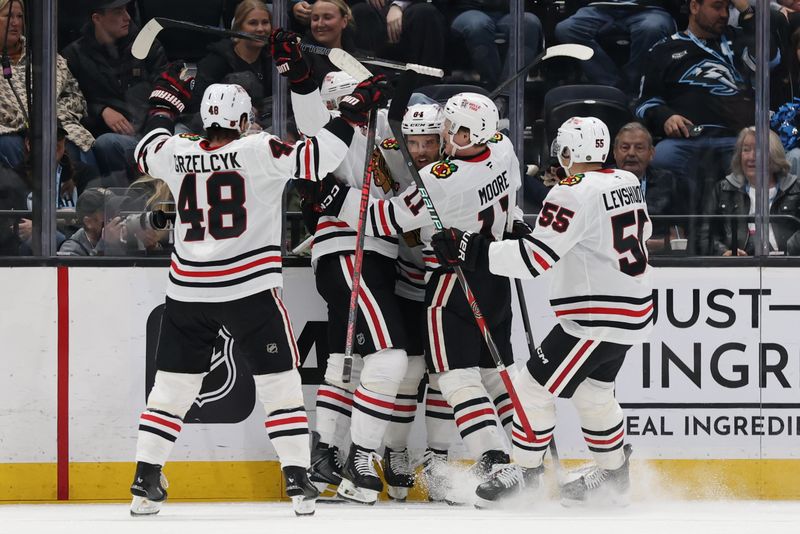 Mar 1, 2026; Salt Lake City, Utah, USA; The Chicago Blackhawks celebrate a goal by left wing Landon Slaggert (84) against the Utah Mammoth during the second period at Delta Center. Mandatory Credit: Rob Gray-Imagn Images