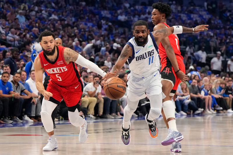 DALLAS, TEXAS - APRIL 07: Kyrie Irving #11 of the Dallas Mavericks is defended by Fred VanVleet #5 and Amen Thompson #1 of the Houston Rockets during the first half at American Airlines Center on April 07, 2024 in Dallas, Texas. NOTE TO USER: User expressly acknowledges and agrees that, by downloading and or using this photograph, User is consenting to the terms and conditions of the Getty Images License Agreement. (Photo by Sam Hodde/Getty Images)