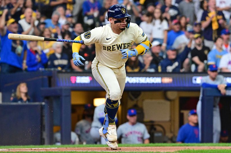Oct 1, 2024; Milwaukee, Wisconsin, USA; Milwaukee Brewers catcher William Contreras (24) hits a RBI single against the New York Mets during the first inning in game one of the Wildcard round for the 2024 MLB Playoffs at American Family Field. Mandatory Credit: Benny Sieu-Imagn Images