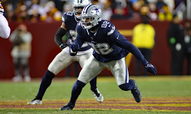 FILE - Dallas Cowboys defensive end Dorance Armstrong (92) runs during an NFL football game against the Washington Commanders, Sunday, Jan. 7, 2024, in Landover, Md. The Washington Commanders have agreed to deals with center Tyler Biadasz and defensive lineman Dorance Armstrong, according to two people familiar with the agreements. The people spoke to The Associated Press on condition of anonymity Monday, March 11, 2024, because the contracts cannot be made official until the new league year opens Wednesday.(AP Photo/Daniel Kucin Jr., File)