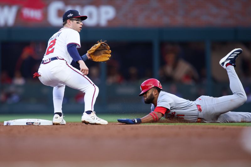 Apr 21, 2025; Atlanta, Georgia, USA; St. Louis Cardinals center fielder Victor Scott II (11) steals second base past Atlanta Braves shortstop Nick Allen (2) in the second inning at Truist Park. Mandatory Credit: Brett Davis-Imagn Images