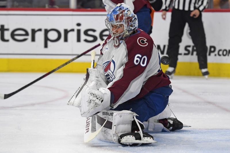 Nov 18, 2024; Philadelphia, Pennsylvania, USA; Colorado Avalanche goaltender Justus Annunen (60) makes a save against the Philadelphia Flyers during the first period at Wells Fargo Center. Mandatory Credit: Eric Hartline-Imagn Images