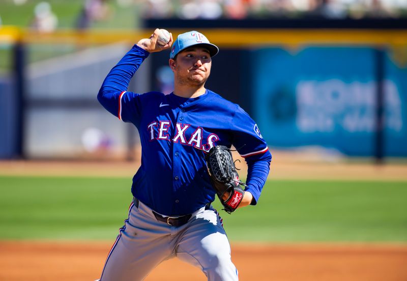 Mar 5, 2024; Peoria, Arizona, USA; Texas Rangers pitcher Owen White against the Seattle Mariners during a spring training baseball game at Peoria Sports Complex. Mandatory Credit: Mark J. Rebilas-USA TODAY Sports