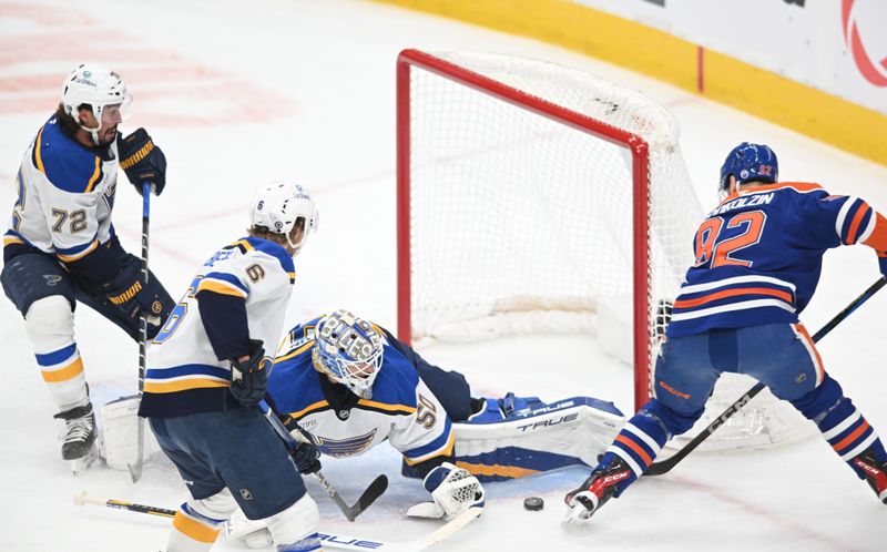 Apr 9, 2025; Edmonton, Alberta, CAN; St. Louis Blues goalie Jordan Binnington (50) makes a save against Edmonton Oilers right wing Vasily Podkolzin (92) during the first period at Rogers Place. Mandatory Credit: Walter Tychnowicz-Imagn Images