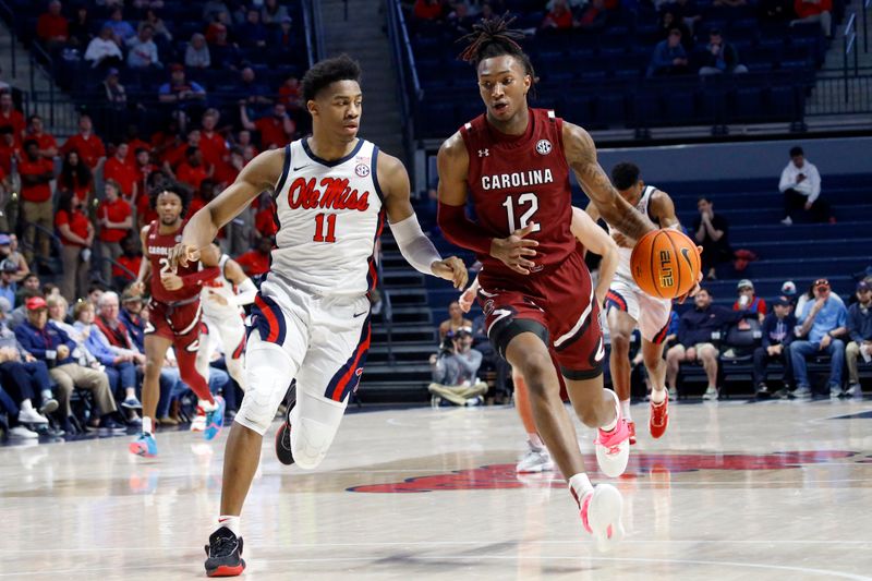 Feb 11, 2023; Oxford, Mississippi, USA; South Carolina Gamecocks guard Zachary Davis (12) drives to the basket as Mississippi Rebels guard Matthew Murrell (11) defends during the first half  at The Sandy and John Black Pavilion at Ole Miss. Mandatory Credit: Petre Thomas-USA TODAY Sports