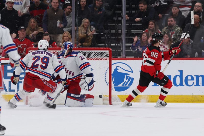 Mar 7, 2026; Newark, New Jersey, USA; New Jersey Devils center Jack Hughes (86) scores a goal against the New York Rangers during the third period at Prudential Center. Mandatory Credit: Thomas Salus-Imagn Images