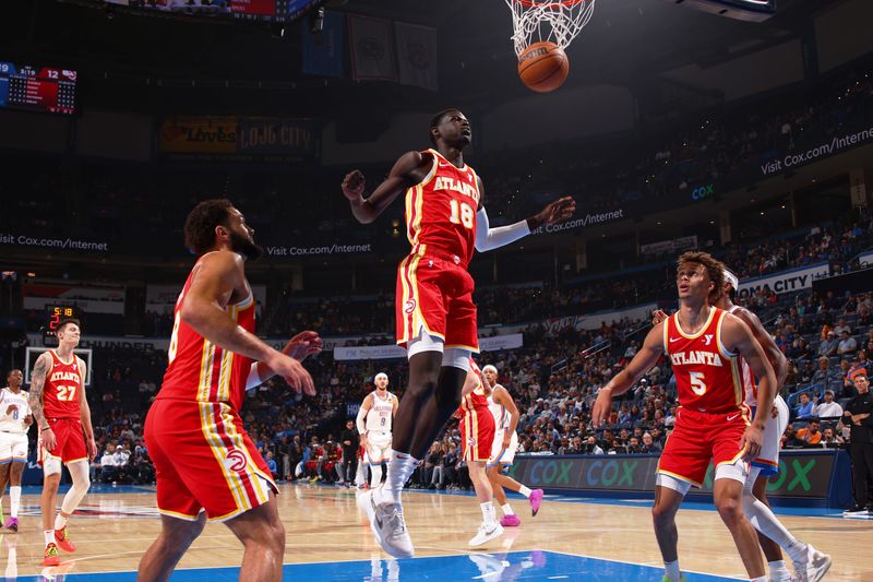 OKLAHOMA CITY, OK - OCTOBER 17: Mouhamed Gueye #18 of the Atlanta Hawks scores a basket at the game against the Oklahoma City Thunder on October 17, 2024 at Paycom Arena in Oklahoma City, Oklahoma. NOTE TO USER: User expressly acknowledges and agrees that, by downloading and or using this photograph, User is consenting to the terms and conditions of the Getty Images License Agreement. Mandatory Copyright Notice: Copyright 2024 NBAE (Photo by Zach Beeker/NBAE via Getty Images)