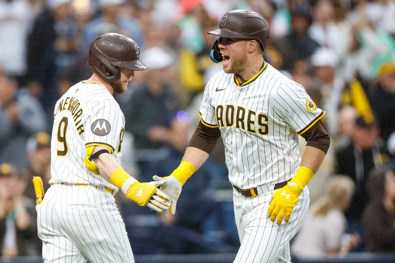 May 17, 2025; San Diego, California, USA; San Diego Padres first baseman Gavin Sheets (30) celebrates with San Diego Padres second baseman Jake Cronenworth (9) after hitting one run home run during the fourth inning against the Seattle Mariners at Petco Park. Mandatory Credit: David Frerker-Imagn Images