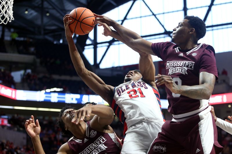 Feb 18, 2023; Oxford, Mississippi, USA; Mississippi State Bulldogs guard Eric Reed Jr. (left), forward D.J. Jeffries (0) and Mississippi Rebels forward Robert Allen (21) battle for a rebound during the second half at The Sandy and John Black Pavilion at Ole Miss. Mandatory Credit: Petre Thomas-USA TODAY Sports