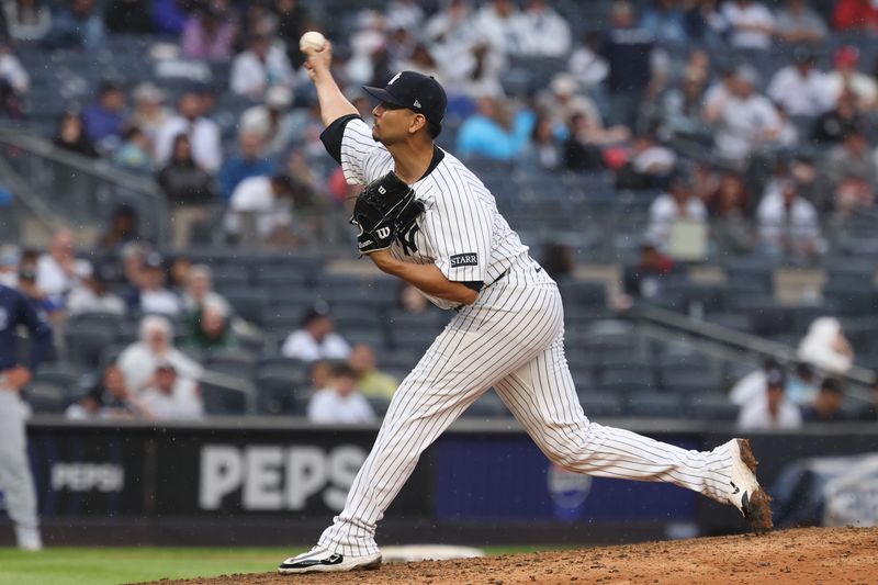 May 4, 2025; Bronx, New York, USA; New York Yankees starting pitcher Carlos Carrasco (59) delivers a pitch during the ninth inning against the Tampa Bay Rays during the ninth inning at Yankee Stadium. Mandatory Credit: Vincent Carchietta-Imagn Images