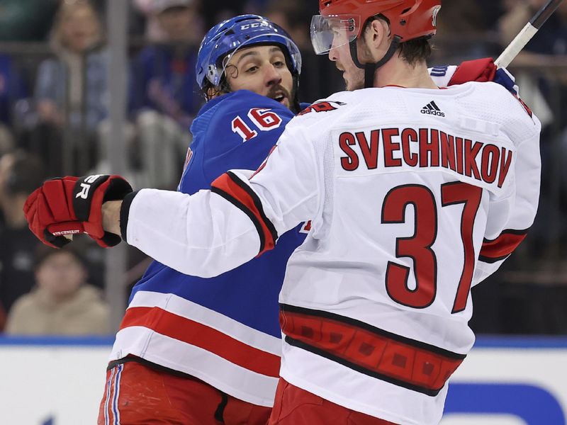 May 13, 2024; New York, New York, USA; New York Rangers center Vincent Trocheck (16) gets tangled up with Carolina Hurricanes right wing Andrei Svechnikov (37) during the first period of game five of the second round of the 2024 Stanley Cup Playoffs at Madison Square Garden. Mandatory Credit: Brad Penner-USA TODAY Sports