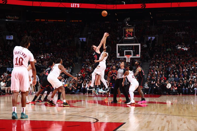 TORONTO, CANADA - FEBRUARY 10: Jakob Poeltl #19 of the Toronto Raptors and Jarrett Allen #31 of the Cleveland Cavaliers go up for a jump ball on February 10, 2024 at the Scotiabank Arena in Toronto, Ontario, Canada.  NOTE TO USER: User expressly acknowledges and agrees that, by downloading and or using this Photograph, user is consenting to the terms and conditions of the Getty Images License Agreement.  Mandatory Copyright Notice: Copyright 2024 NBAE (Photo by Vaughn Ridley/NBAE via Getty Images)