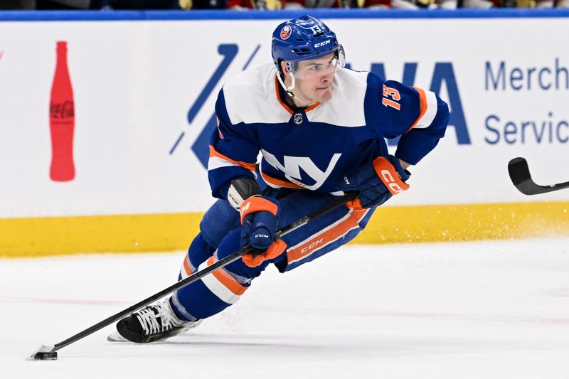 Jan 27, 2024; Elmont, New York, USA; New York Islanders center Mathew Barzal (13) skates with the puck against the Florida Panthers during the third period at UBS Arena. Mandatory Credit: Dennis Schneidler-USA TODAY Sports