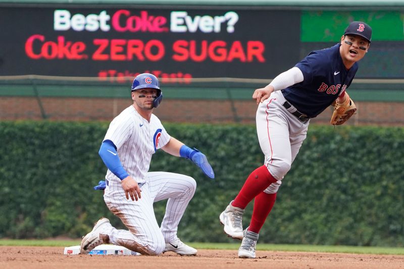 Jul 16, 2023; Chicago, Illinois, USA; Boston Red Sox shortstop Yu Chang (20) forces out Chicago Cubs shortstop Nico Hoerner (2) at second base then throws to first base to complete a double play during the first inning at Wrigley Field. Mandatory Credit: David Banks-USA TODAY Sports