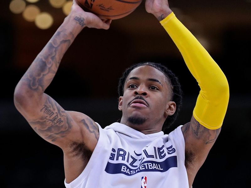 MEMPHIS, TENNESSEE - DECEMBER 07: Ja Morant #12 of the Memphis Grizzlies warms up before the game against the Oklahoma City Thunder at FedExForum on December 07, 2022 in Memphis, Tennessee. NOTE TO USER: User expressly acknowledges and agrees that, by downloading and or using this photograph, User is consenting to the terms and conditions of the Getty Images License Agreement. (Photo by Justin Ford/Getty Images)