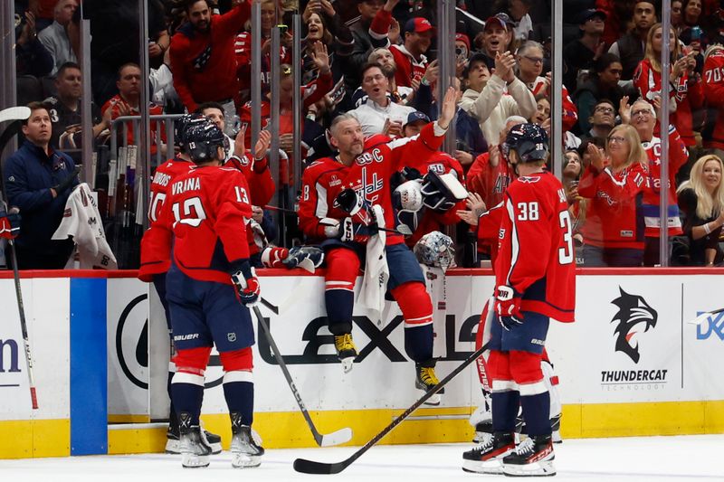 Oct 15, 2024; Washington, District of Columbia, USA; Washington Capitals left wing Alex Ovechkin (8) acknowledges the crowd after being recognized for recording his 700th career assist in the game against the Vegas Golden Knights in the second period at Capital One Arena. Mandatory Credit: Geoff Burke-Imagn Images