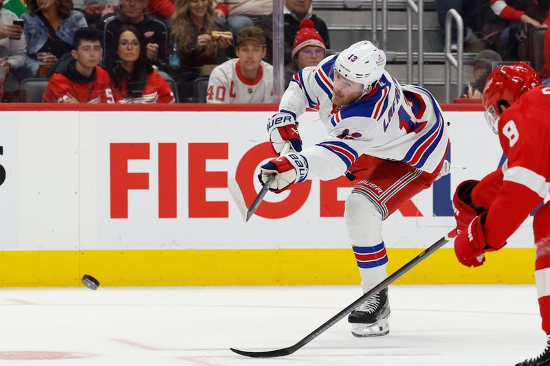 Oct 17, 2024; Detroit, Michigan, USA;  New York Rangers left wing Alexis Lafrenière (13) takes a shot in the first period against the Detroit Red Wings at Little Caesars Arena. Mandatory Credit: Rick Osentoski-Imagn Images