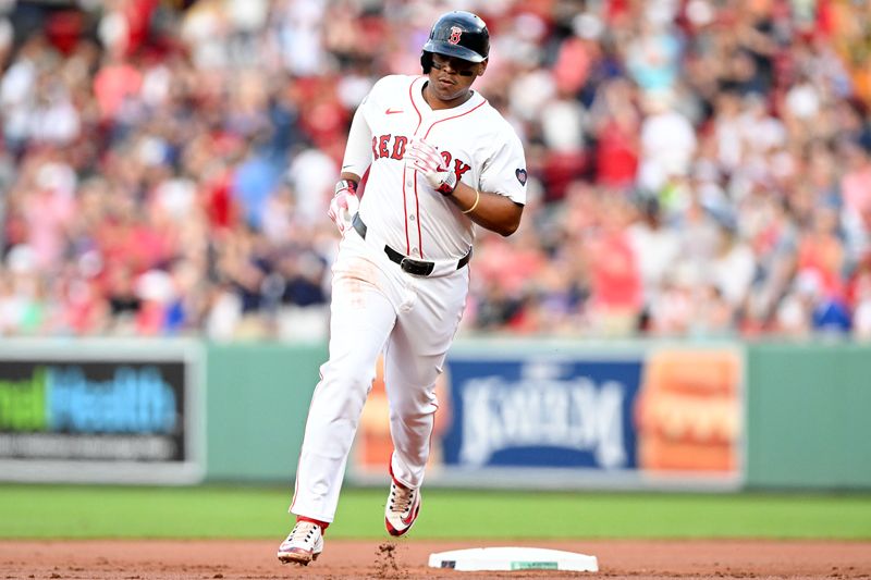 Jun 25, 2024; Boston, Massachusetts, USA; Boston Red Sox third baseman Rafael Devers (11) runs the bases after hitting a solo home run against the Toronto Blue Jays during the second inning at Fenway Park. Mandatory Credit: Brian Fluharty-USA TODAY Sports