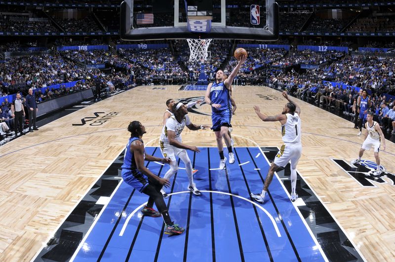 ORLANDO, FL - MARCH 10: Joe Ingles #7 of the Orlando Magic goes to the basket during the game on March 10, 2024 at Amway Center in Orlando, Florida. NOTE TO USER: User expressly acknowledges and agrees that, by downloading and or using this photograph, User is consenting to the terms and conditions of the Getty Images License Agreement. Mandatory Copyright Notice: Copyright 2024 NBAE (Photo by Fernando Medina/NBAE via Getty Images)