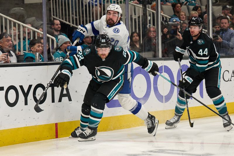 Mar 21, 2024; San Jose, California, USA; San Jose Sharks center Ryan Carpenter (22) and defenseman Marc-Edouard Vlasic (44) defend against Tampa Bay Lightning left wing Nicholas Paul (20) during the first period at SAP Center at San Jose. Mandatory Credit: Robert Edwards-USA TODAY Sports