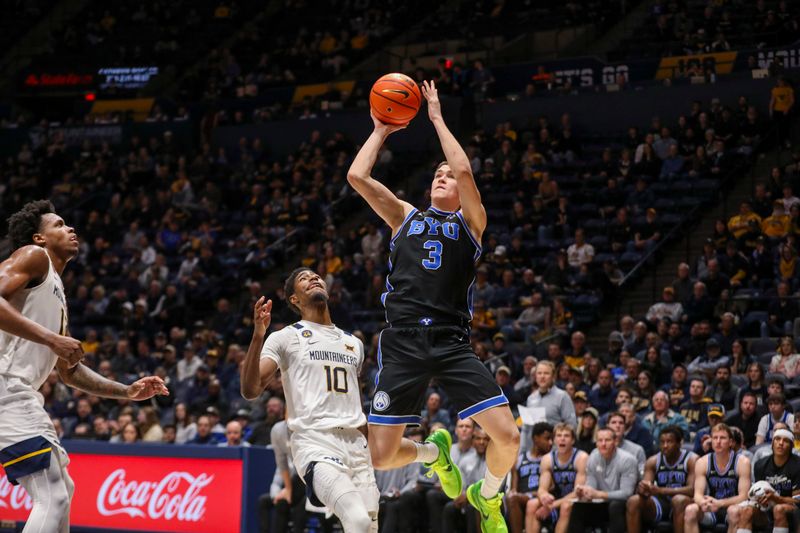 Feb 11, 2025; Morgantown, West Virginia, USA; Brigham Young Cougars guard Egor Demin (3) shoots against West Virginia Mountaineers guard Sencire Harris (10) during the second half at WVU Coliseum. Mandatory Credit: Ben Queen-Imagn Images