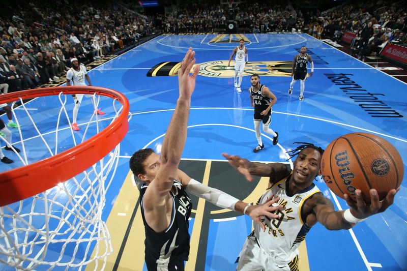 MILWAUKEE, WI - NOVEMBER 22:  Quenton Jackson #29 of the Indiana Pacers drives to the basket during the game against the Milwaukee Bucks during a Emirates NBA Cup on November 22, 2024 at Fiserv Forum Center in Milwaukee, Wisconsin. NOTE TO USER: User expressly acknowledges and agrees that, by downloading and or using this Photograph, user is consenting to the terms and conditions of the Getty Images License Agreement. Mandatory Copyright Notice: Copyright 2024 NBAE (Photo by Gary Dineen/NBAE via Getty Images).